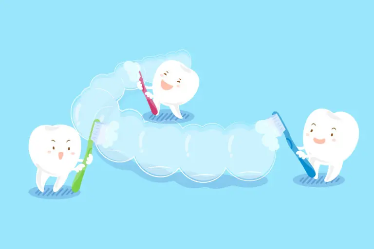In this image, three cartoon teeth holding toothbrushes demonstrate how to clean Invisalign trays by brushing a large, transparent retainer, with a light blue background—a visual tip from Andros Orthodontics in Pasco, WA.