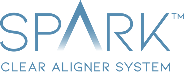 At Andros Orthodontics in Pasco, WA, the Spark Clear Aligner System logo features "SPARK" in large blue letters with "CLEAR ALIGNER SYSTEM" displayed underneath in smaller text.